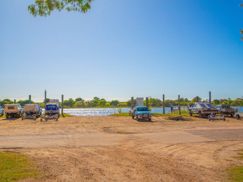 Vehicles and boat trailers beside the Groper Creek boat ramp
